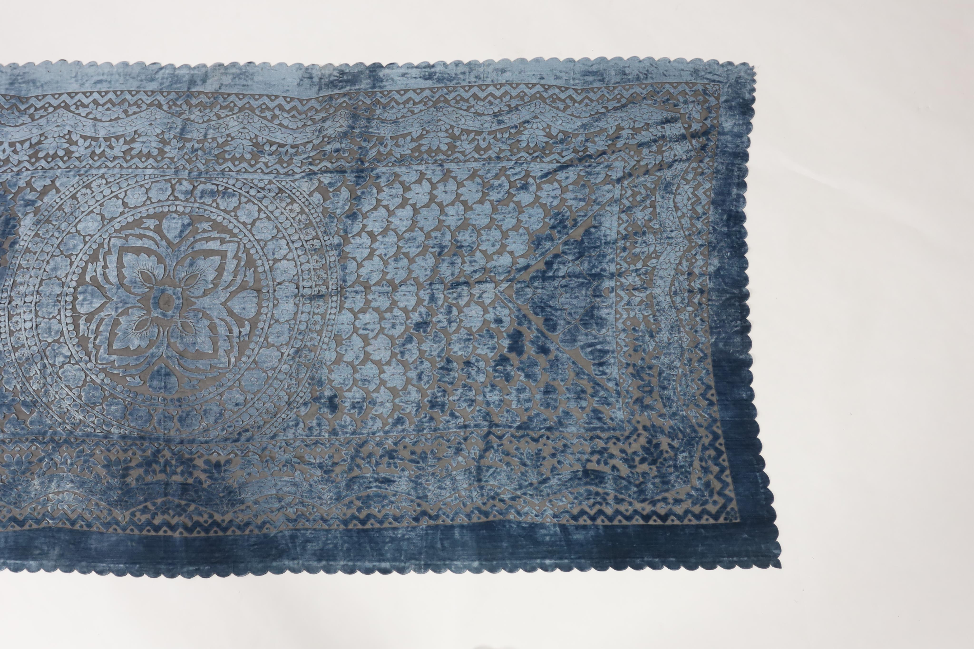 A 20th century blue and black patterned silk cut velvet evening stole with scalloped borders, 102cm wide x 224cm long